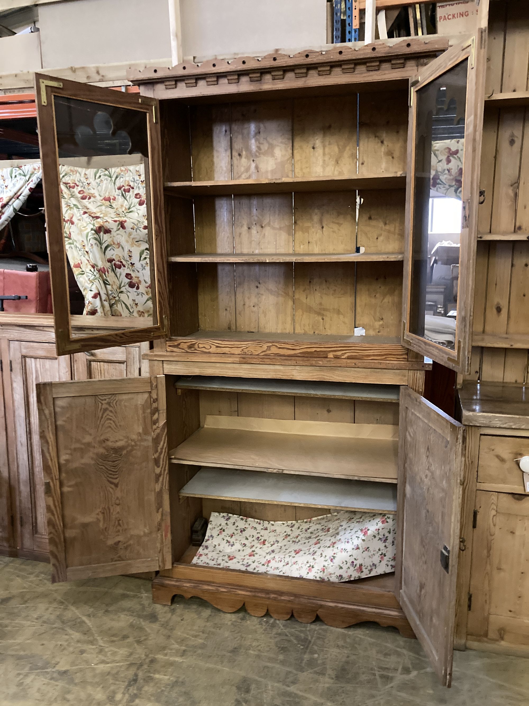 A 19th century Continental pine glazed cabinet, width 112cm, depth 49cm, height 214cm